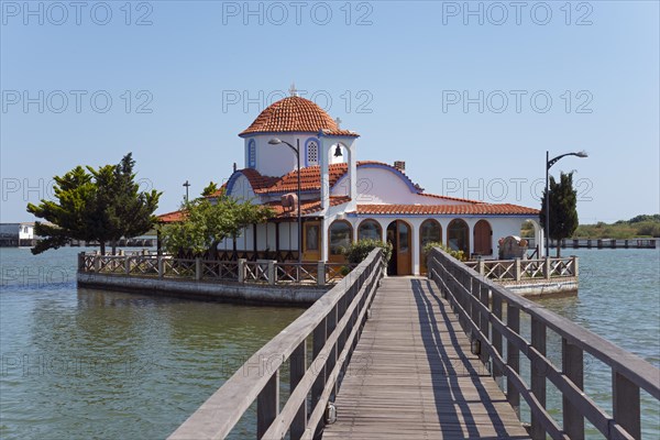 Small church on the waterfront connected by a wooden bridge, Monastery of St Nicholas, Monastery of Agios Nikolaos, Agiou Nikolaou, Vistonidas Burma Lagoon, Porto Lagos, Xanthi, Eastern Macedonia and Thrace, Greece, Europe