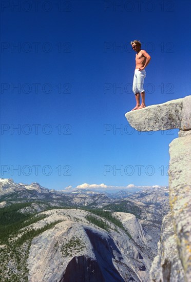 Man standing on top of Half Dome, Yosemite Valley National Park, California, USA, vintage, retro, North America