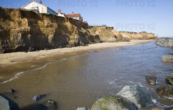 Cliff top buildings at risk of coastal erosion, Happisburgh, Norfolk, England, United Kingdom, Europe