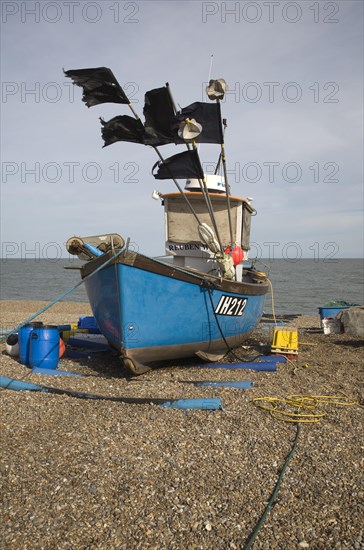 Fishing boats and equipment on the shingle beach at Aldeburgh, Suffolk, England, United Kingdom, Europe