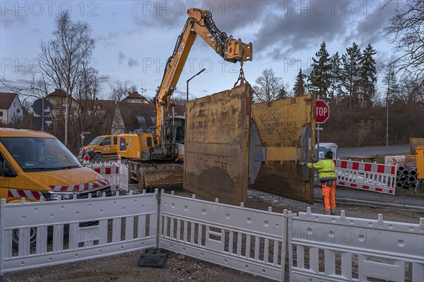 Road construction site: Excavator with a civil engineering safety device on the hook, Eckental, Middle Franconia, Bavaria, Germany, Europe