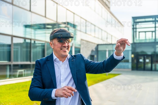 Businessman in a futuristic experience with mixed reality glasses outside a financial building