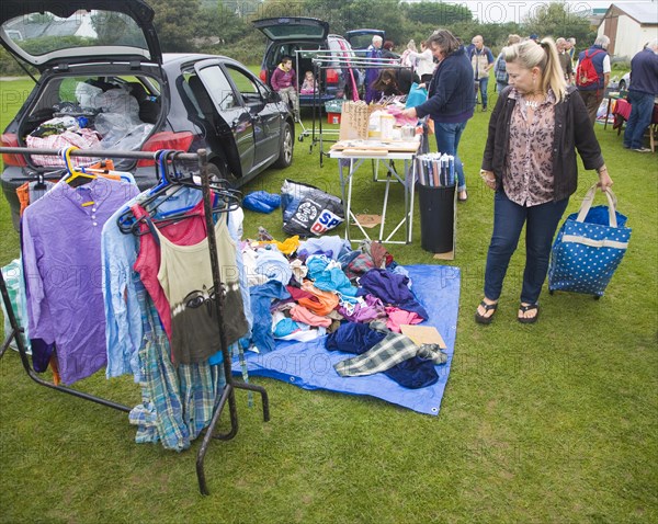 Clothing on display at a car boot sale, UK