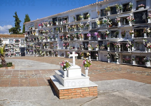 Traditional cemetery decorated with flowers in the Andalucian village of Comares, Malaga province, Spain, Europe