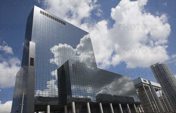 Clouds reflected by surface of Nationale Nederlanden office building in Rotterdam, Netherlands