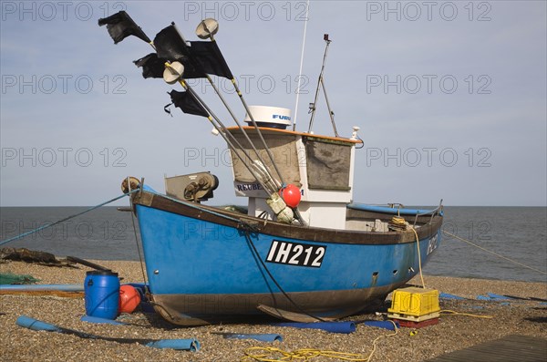 Fishing boats and equipment on the shingle beach at Aldeburgh, Suffolk, England, United Kingdom, Europe