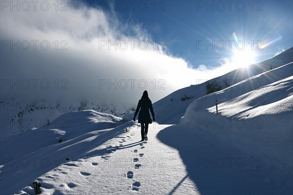 Hiking in a winter landscape in the Beverin nature park Park, Graubuenden, Switzerland, Europe