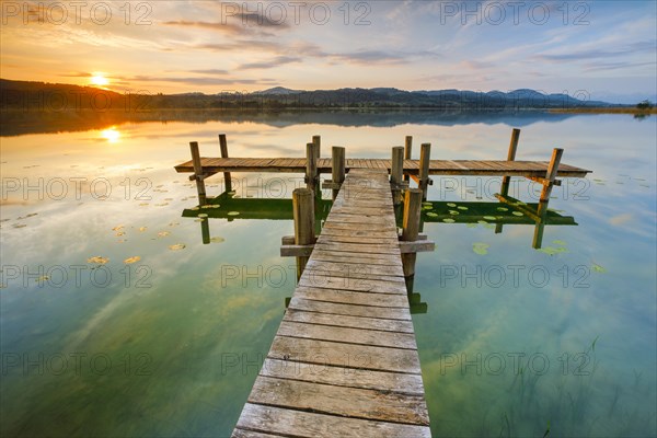 Wooden footbridge on Lake Pfaeffikon at sunrise, Pfaeffikon, Canton Zurich, Switzerland, Europe