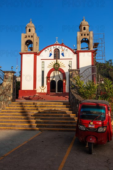 Motorbike taxi in front of the Inglesia Ave Maria church, Pluma Hidalgo, Pochutla, Oxaca state, Sierra Madre del Sur, Mexico, Central America