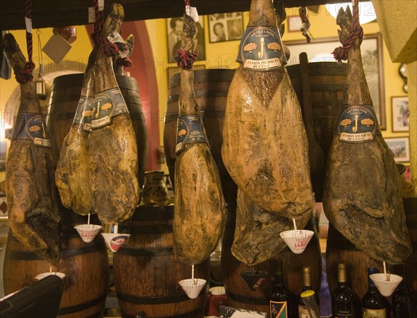 Jamones smoked ham hanging in traditional bar Ronda, Spain, Europe
