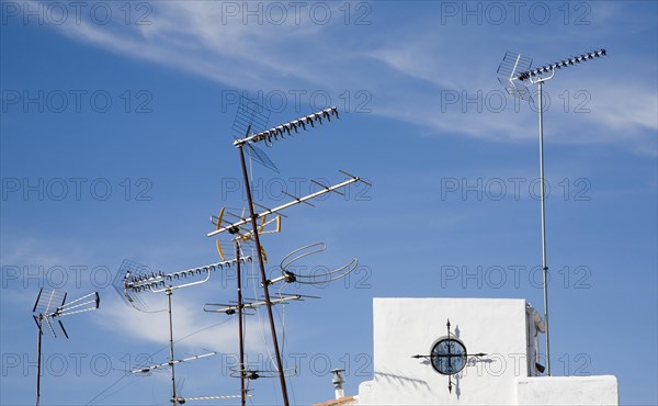Confused mrs of TV aerials on rooftop in Ronda, Spain, Europe