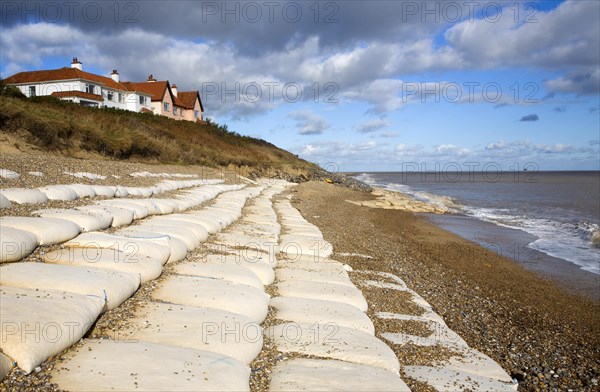 Coastal defences normally covered by shingle exposed by winter storms at Thorpeness, Suffolk, England in November 2013