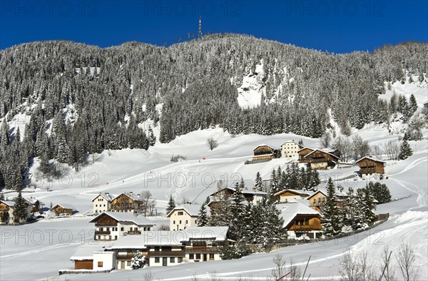 The mountain village of Corvara, Kurfar, at the foot of the Col Alto high plateau in winter, Alta Badia ski area, Dolomites, South Tyrol, Italy, Europe