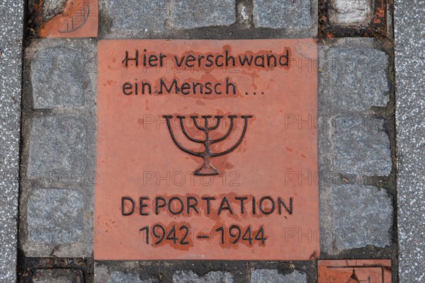 Memorial stone on a pavement at Magdeburg Central Station with an inscription commemorating the deportation of people 1942-1944, Magdeburg, Saxony-Anhalt, Germany, Europe