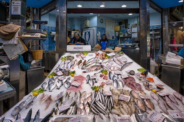 Trader, fishmonger working in his market stall, display of fresh fish and seafood on ice, Food, Kapani Market, Vlali, Thessaloniki, Macedonia, Greece, Europe