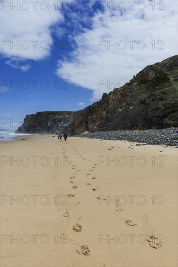 Beach walk in front of rocky beach landscape, walk, tracks, footprints, path, hike, hike, beach, sand, rocks, sea, Atlantic coast, rocky coast, sea, natural landscape, travel, nature, Southern Europe, Carrapateira, Algarve, Portugal, Europe