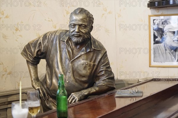 Bronze statue of Ernest Hemingway in the Bar Floridita, Hemingway's favourite bar, in the old town of Habana Vieja, Havana, Cuba, Caribbean, Central America