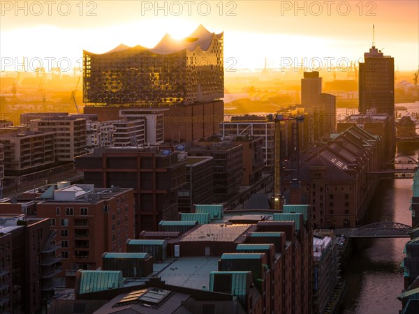 Aerial view of Hamburg harbour at sunset with Speicherstadt warehouse district and Elbe Philharmonic Hall concert hall, Hamburg, Germany, Europe