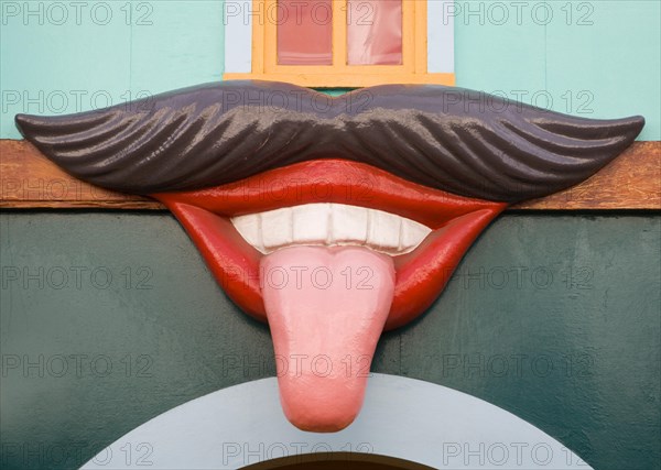 Giant mouth with moustache lips teeth and tongue sticking out, Pleasure Beach funfair, Great Yarmouth, Norfolk, England, United Kingdom, Europe
