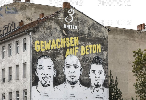 A picture of the brothers Jerome Boateng, George Boateng and Kevin-Prince Boateng can be seen on a wall in the Wedding district of Berlin. The mural Grown on concrete is located in the Wedding district and is intended to symbolise the career of the three Boateng brothers and the history of their football pitch in Wedding. the graffiti with the inscription was applied by Nike, 29.09.2019