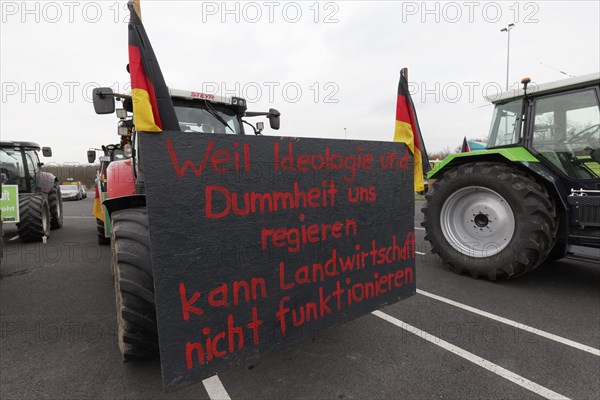 Sign criticising the government on a tractor, farmers' protests, demonstration against policies of the traffic light government, abolition of agricultural diesel subsidies, Duesseldorf, North Rhine-Westphalia, Germany, Europe