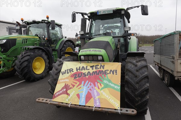 We stick together, sign on a tractor, farmers' protests, demonstration against policies of the traffic light government, abolition of agricultural diesel subsidies, Duesseldorf, North Rhine-Westphalia, Germany, Europe