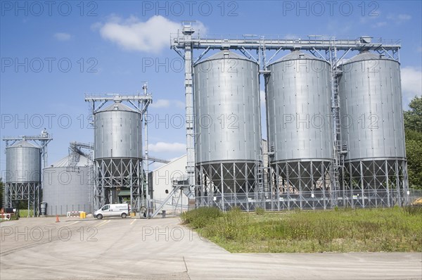 Large steel grain silos for barley at Mendlesham, Suffolk, England, United Kingdom, Europe