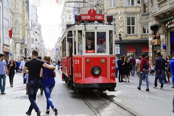 Historic tram Nostaljik Tramvay travelling through Istiklal Caddesi shopping street, Beyoglu, Istanbul, European part, Istanbul province, Turkey, Asia