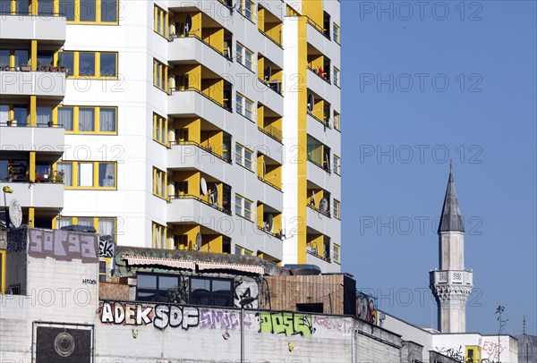 Minaret of the Mevlana mosque next to a high-rise building in Berlin's Kreuzberg district, 12 October 2018