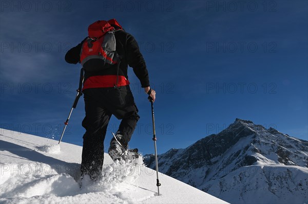 Snowshoe hiking in the Beverin nature park Park, Graubuenden, Switzerland, Europe