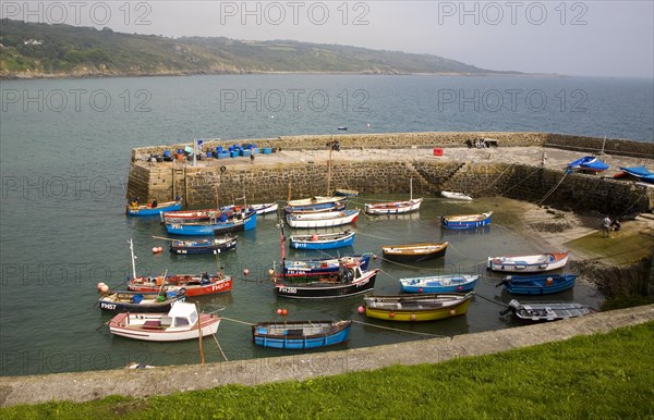 Small fishing boats in the harbour at the village of Coverack on the Lizard peninsula, Cornwall, England, United Kingdom, Europe