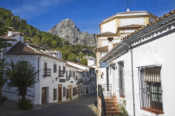 Limestone mountain peaks tower over the Village of Grazalema, Cadiz province, Spain, Europe