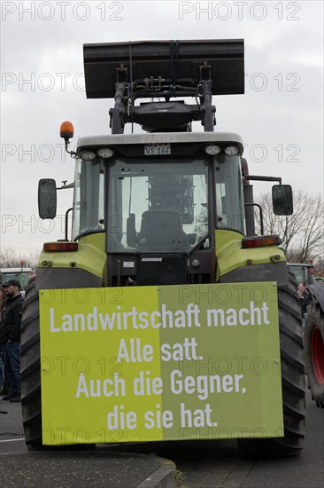 Tractor with poster on agriculture, farmers' protests, demonstration against the policy of the traffic light government, abolition of agricultural diesel subsidies, Duesseldorf, North Rhine-Westphalia, Germany, Europe