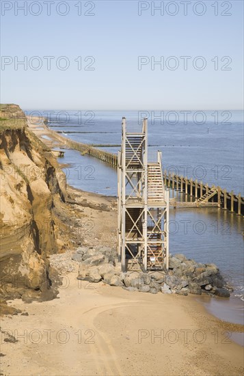 Former beach access stairs now stand alone as coastal erosion continues, Happisburgh, Norfolk, England, United Kingdom, Europe