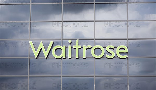 Dark clouds reflected in glass surface of Waitrose store, Ipswich, Suffolk, England, United Kingdom, Europe