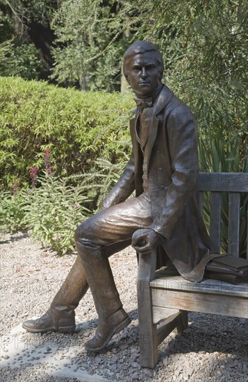 Charles Darwin as a young man sculpture 2002 by Anthony Smith, Christ's College, University of Cambridge, England, United Kingdom, Europe