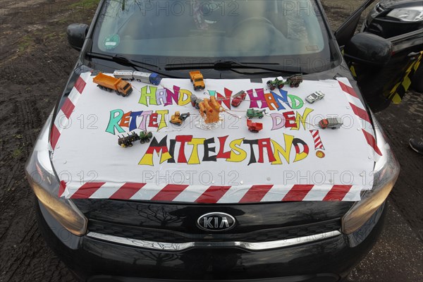 Placard with the theme Mittelstand on a car, farmers' protests, demonstration against the policy of the traffic light government, abolition of agricultural diesel subsidies, Duesseldorf, North Rhine-Westphalia, Germany, Europe