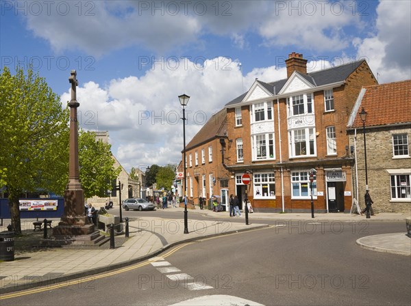 Buildings and war memorial in the Market Place in Thetford, Norfolk, England, United Kingdom, Europe