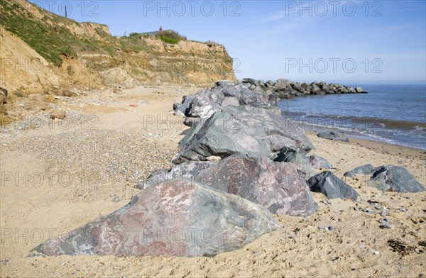 Rock armour used to defend soft crumbling cliffs, Happisburgh, Norfolk, England, United Kingdom, Europe