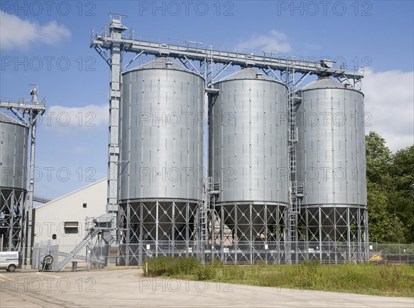Large steel grain silos for barley at Mendlesham, Suffolk, England, United Kingdom, Europe