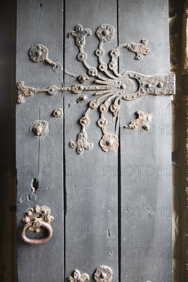 Ornate metalwork hinges on the door to the Percy family chapel, Tynemouth priory, Northumberland, England, United Kingdom, Europe
