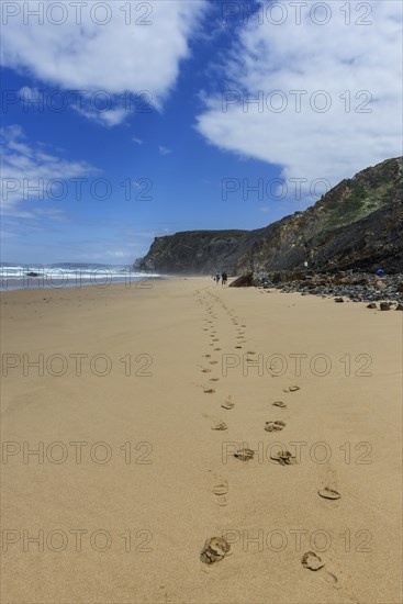 Beach walk in front of rocky beach landscape, walk, tracks, footprints, path, hike, hike, beach, sand, rocks, sea, Atlantic coast, rocky coast, sea, natural landscape, travel, nature, Southern Europe, Carrapateira, Algarve, Portugal, Europe