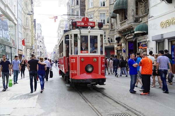 Historic tram Nostaljik Tramvay travelling through Istiklal Caddesi shopping street, Beyoglu, Istanbul, European part, Istanbul province, Turkey, Asia