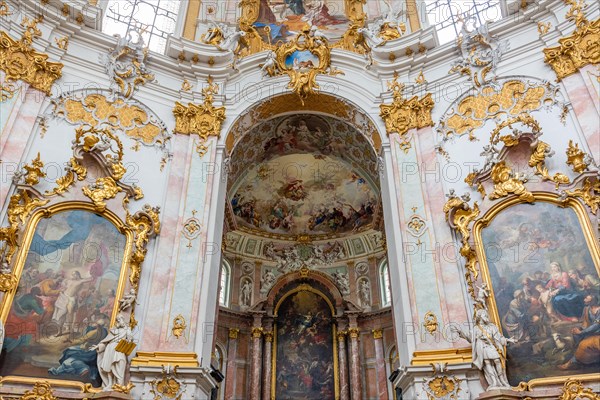 Interior view of a baroque church with richly decorated golden ornaments and ceiling frescoes, Benedictine Abbey of Ettal, Bavaria