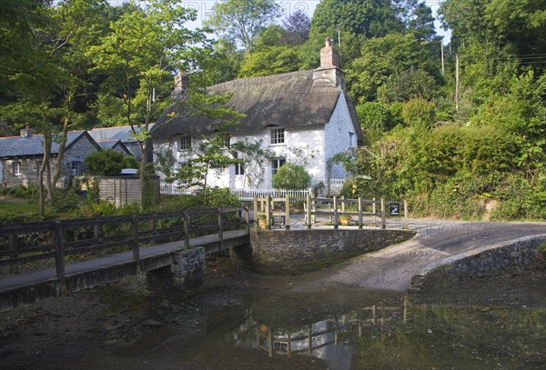 Pretty traditional thatched cottages in the village of Helford village, Cornwall, England, United Kingdom, Europe