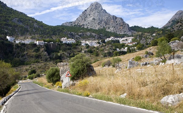 Limestone mountain peaks tower over the Village of Grazalema, Cadiz province, Spain, Europe