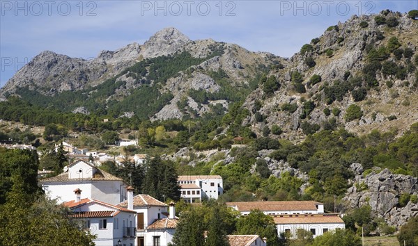 Limestone mountain peaks tower over the Village of Grazalema, Cadiz province, Spain, Europe