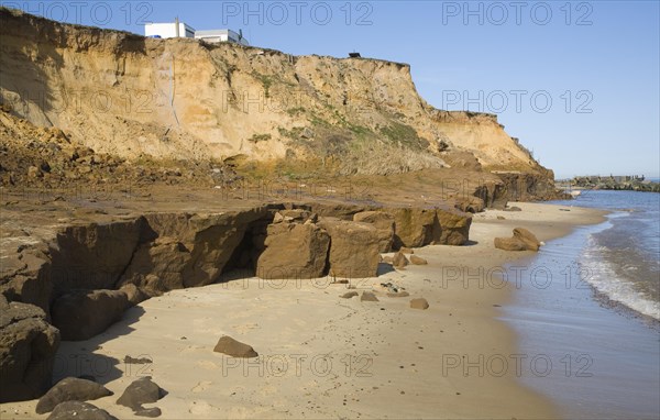 Cliff top buildings at risk of coastal erosion, Happisburgh, Norfolk, England, United Kingdom, Europe