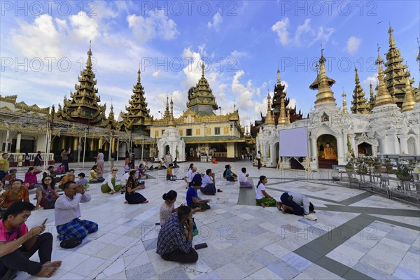 Pilgrims in the Shwedagon Pagoda, Yangon, Myanmar, Asia