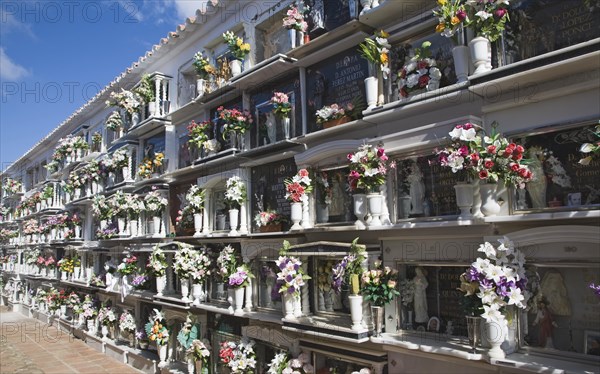 Traditional cemetery decorated with flowers in the Andalucian village of Comares, Malaga province, Spain, Europe